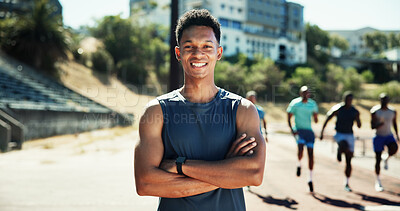 Buy stock photo Portrait, athlete and man with smile at stadium for exercise, sports training and practice on track field. Male runner, arms crossed and prude for fitness, workout and endurance of marathon challenge