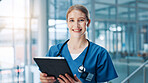 Nurse, woman and happy with tablet in portrait, corridor and report for healthcare services at clinic. Person, touchscreen and smile with app, medical research and results at hospital in Germany