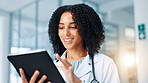 Doctor, woman and happy with tablet with typing, report and healthcare services in hallway at clinic. Person, touchscreen and smile with app, online consulting and telehealth with contact at hospital