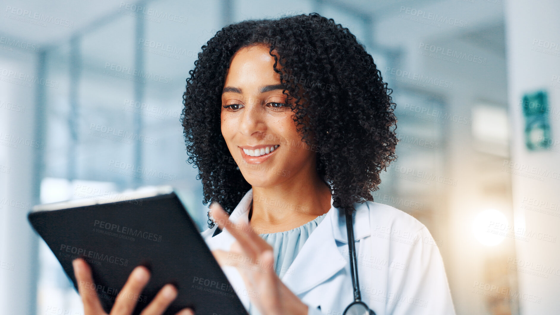 Buy stock photo Doctor, woman and happy with tablet with typing, report and healthcare services in hallway at clinic. Person, technology and smile with app, online consulting and telehealth with contact at hospital
