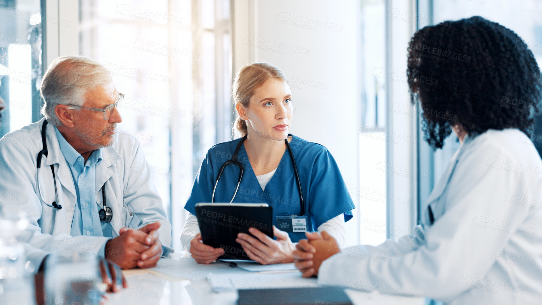 Buy stock photo Tablet, discussion and team of doctors in hospital boardroom with medical report for treatment planning. Digital technology, research and group of healthcare workers with surgery schedule in clinic.