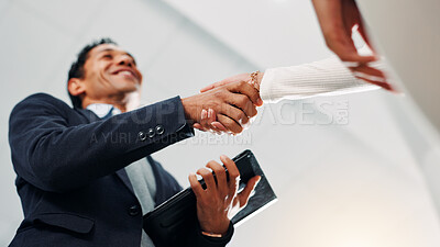 Buy stock photo Shaking hands, negotiation and business people in office with deal, partnership or contract. Collaboration, low angle and financial manager with client for agreement, welcome or thank you handshake.
