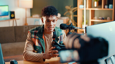 Buy stock photo Man, influencer and online streaming with video camera for gaming tips, tutorial or live recording. Male person, podcaster or gamer guide with vr goggles or technology for vlog or review at home