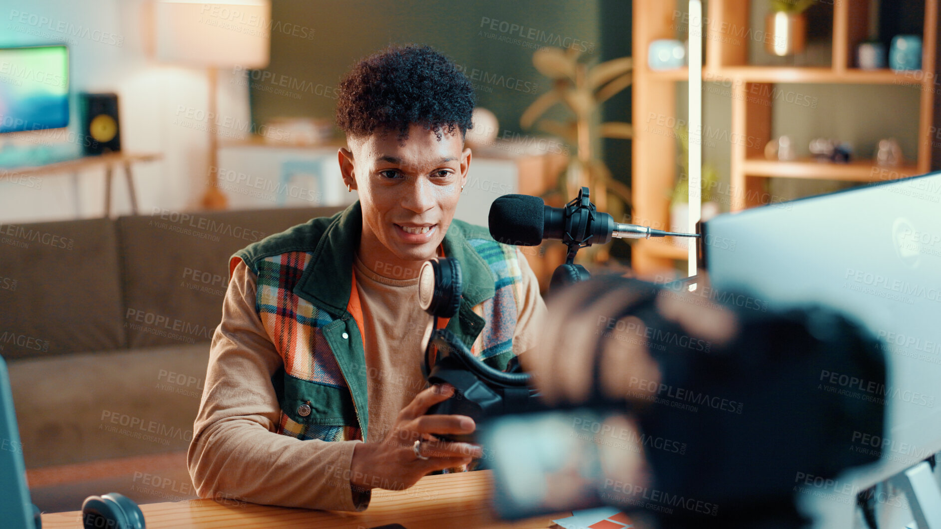 Buy stock photo Man, influencer and online streaming with video camera for gaming tips, tutorial or live recording. Male person, podcaster or gamer guide with vr goggles or technology for vlog or review at home
