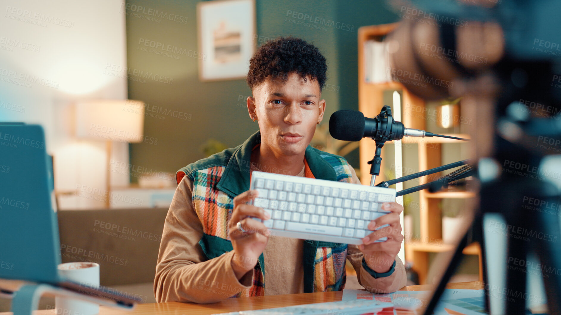 Buy stock photo Content creator, keyboard and man live streaming for review, podcast or social media promotion. Filming, product or influencer show technology for advertising, vlog or opinion for gaming gear at home