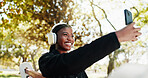 Outdoor, athlete and woman with headphones, selfie and picture for self motivation on social media. Park, happy and black person with smile for post, influencer and photography for fitness progress