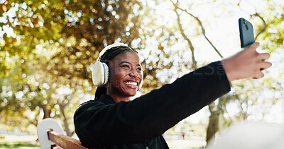 Buy stock photo Outdoor, athlete and woman with headphones, selfie and picture for self motivation on social media. Park, happy and black person with smile for post, influencer and photography for fitness progress