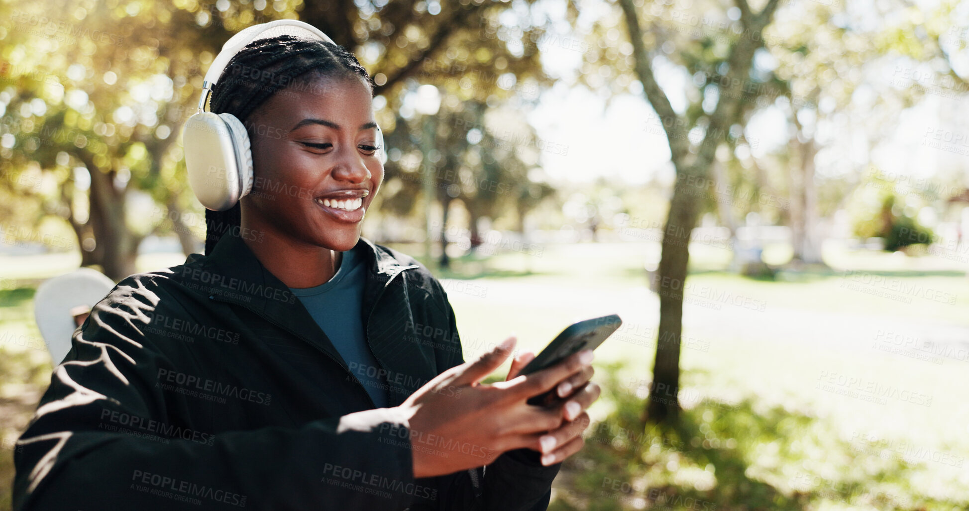 Buy stock photo Outdoor, fitness and woman with smartphone, browsing and tracking progress of exercise on app and smile. Happy, athlete and black person with mobile for social media, headphones or listening to music