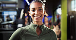 Portrait, healthy and woman with smile in gym, confident and commitment to training routine or workout. Happy, athlete and person with pride for wellness, morning and sportswear for fitness center