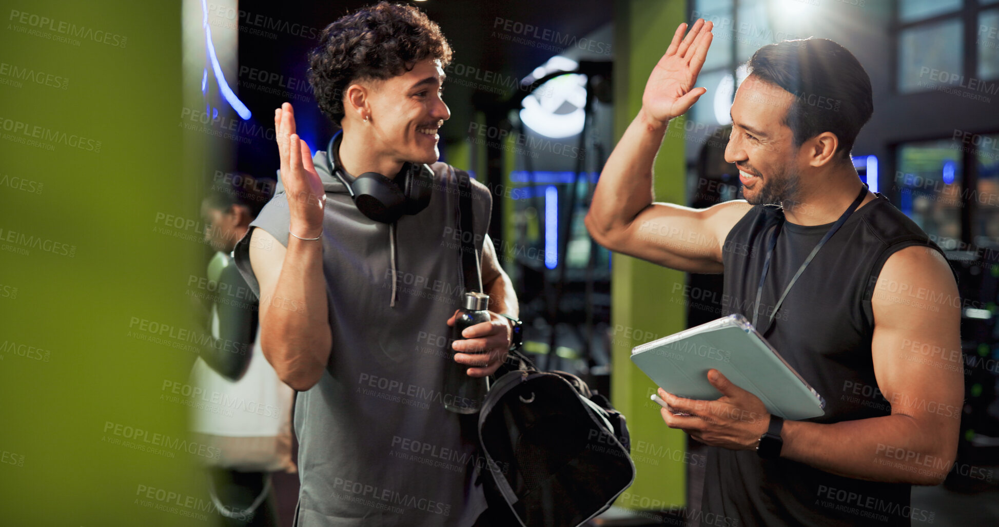 Buy stock photo Men, personal trainer and tablet with high five at gym with smile, success or cheers for exercise goals. People coach and touchscreen with app for training, happy or congratulations at fitness center