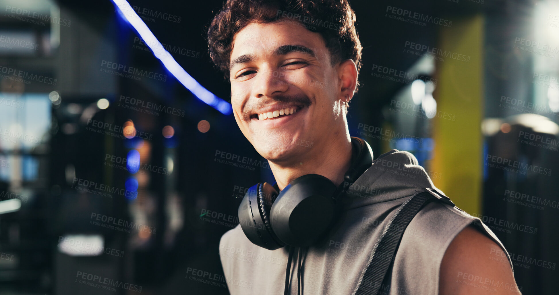Buy stock photo Man, portrait and headphones at gym with smile, confident and ready for routine at exercise center. Person, happy and bodybuilder with pride for workout, training and fitness at club in Portugal