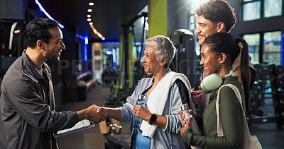 Buy stock photo Man, woman and handshake with welcome at gym for class, registration and tablet with exercise group. Mature person, personal trainer and touchscreen for respect, app or introduction at fitness center