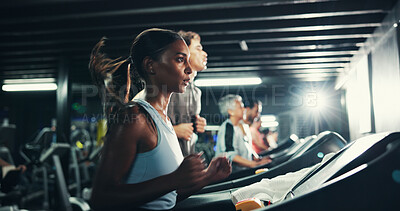 Buy stock photo Exercise, woman and running on treadmill in gym at night for fitness training, endurance challenge and calorie burning. Breathe, late workout or girl with sweating for intense cardio or race practice
