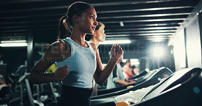 Buy stock photo Fitness, girl and running on treadmill in gym at night for agility training, endurance challenge or burning calories. Sweating, late exercise and runner with speed for intense cardio or race practice