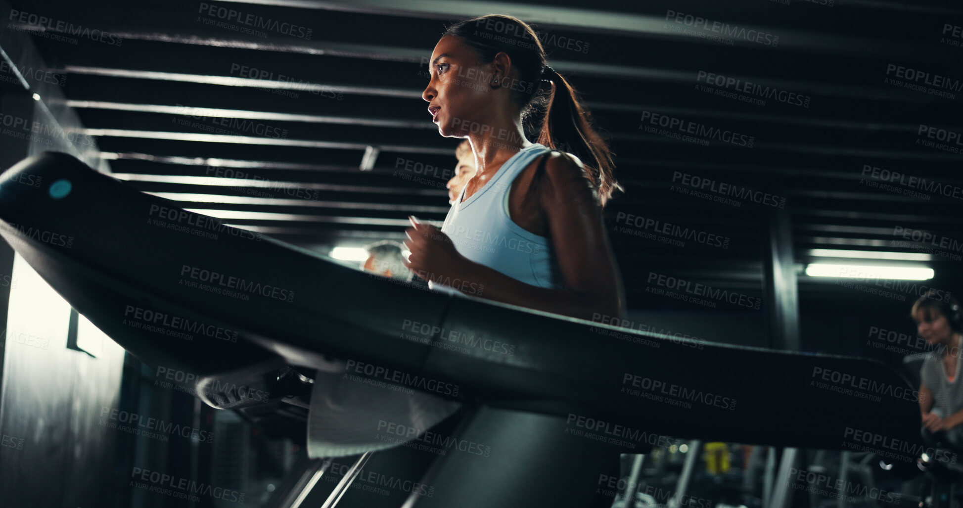 Buy stock photo Runner, gym and health with woman on treadmill for training, exercise and cardio performance. Wellness, fitness and workout challenge with person on running machine for sports, athlete and low angle