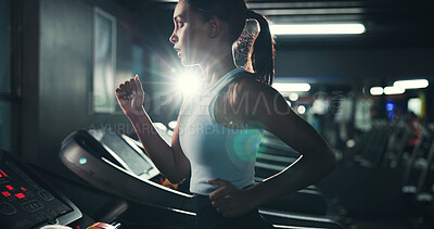 Buy stock photo Fitness, woman and running on treadmill in gym at night for agility training, speed development or calorie burning. Flare, evening workout or girl on machine for cardio exercise or muscle performance