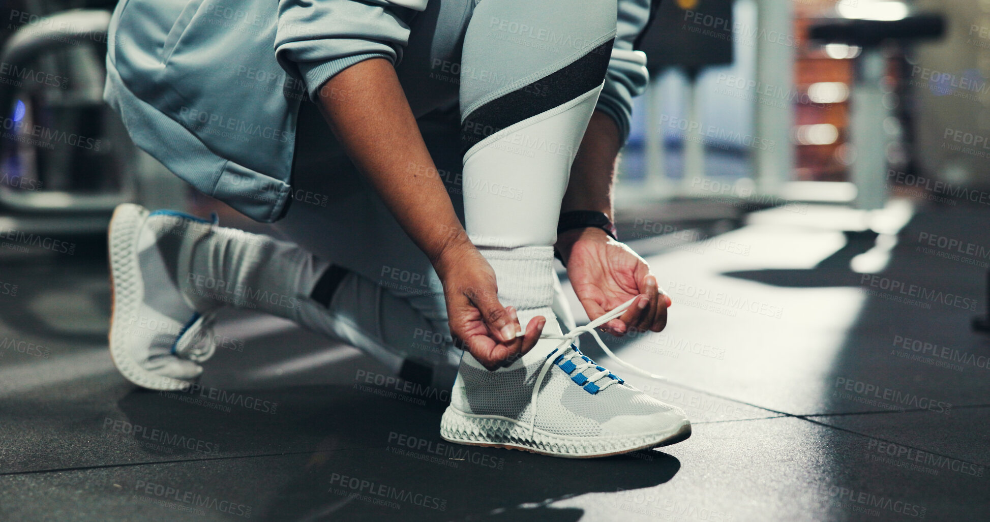 Buy stock photo Hands, shoe laces and floor at gym, ready and start with training, wellness and sneakers for exercise. Person, legs and prepare for workout, fitness and challenge with sportswear for routine at club