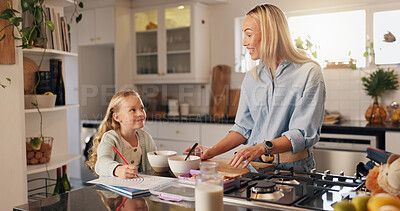 Buy stock photo Happy, mom and child with breakfast in house, talking and smile for healthy food in kitchen or care. Morning, woman and daughter with homework on table, growth and development of kid, meal and home