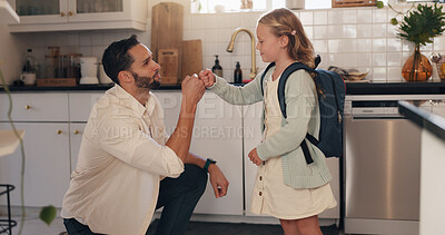 Buy stock photo Father, child and fist bump in home for school, motivation and support to start day in kitchen. Dad, girl and care with connection, love and bonding with backpack for education in family house