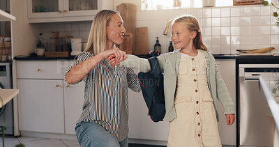 Buy stock photo Kitchen, mother and child with backpack for school, help and bonding together with morning routine. Home, parenthood and mom with girl ready for leaving, education and learning on first day in house