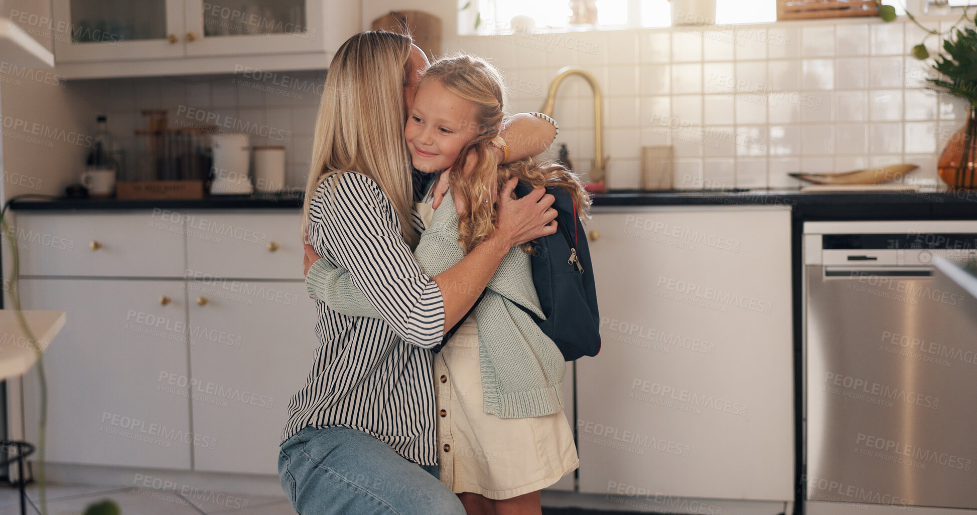 Buy stock photo Kitchen, mother and child with hug for school, goodbye and bonding together with morning routine. Home, parenthood and mom with girl ready for leaving, support and education on first day in house
