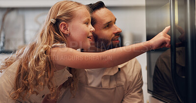 Buy stock photo Kitchen, father and child by oven for baking, learning and bonding together with happy expression. Home, parent and dad with pointing girl for cooking, teaching and family waiting for stove in house