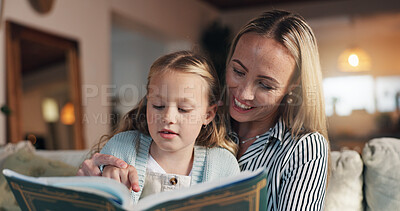 Buy stock photo Mom, girl and reading book on sofa, learning and support with development, love and bonding in lounge. People, mother and daughter with literature, education and helping hand on couch at family house