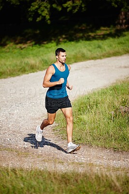 Buy stock photo Runner, man and sports in outdoor for exercise, health and wellness in nature for workout or fitness. Male athlete, training and cardio with endurance, muscles and strength for healthy living or gym
