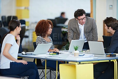 Buy stock photo Collaboration, business and conversation in office for brainstorming new company, workshop and internship. Men, women and teamwork at desk with laptop for web design, planning and startup project