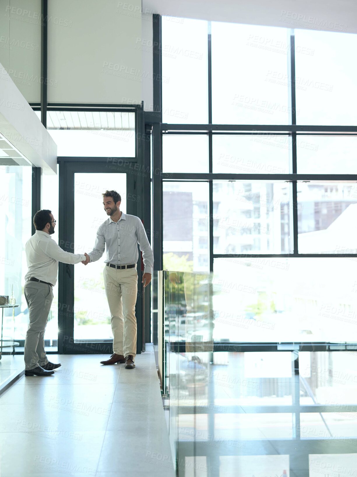 Buy stock photo Welcome, handshake and business people in office building for consulting, help or b2b networking. Teamwork, partnership and men shaking hands for thank you, collaboration and hiring, deal or offer