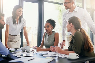 Buy stock photo Woman, business and staff for meeting in office with paperwork for feedback or review of company sales. Employee, people and discussion in workshop with support of manager for ideas on project growth