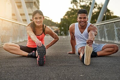 Buy stock photo Fitness, portrait and couple stretch on bridge for health, wellness or warmup for run. Man, woman and training on road for cardio, preparation and workout together in city for marathon, jog or sprint