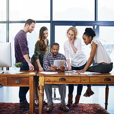 Buy stock photo Creative, men and women with tablet in workshop for planning, brainstorming or problem solving in office. Teamwork, ideas and business people with digital app for collaboration at design startup.