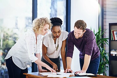 Buy stock photo Business people, planning and teamwork with book publishing, brainstorming and reading or editing manuscript. Designer, writer and editor in meeting with ideas, solution or collaboration on documents