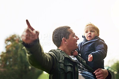Buy stock photo Pointing, dad and kid in nature with happy fun, showing and bonding in outdoor garden. Father, son and playful learning in backyard for growth, child development and teaching with support in park
