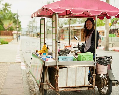 Buy stock photo Asian woman, portrait and food vendor in street with fruit while driving motorcycle as startup in Thailand. Entrepreneur, face and work as small business owner with banana, cart and motorbike in road