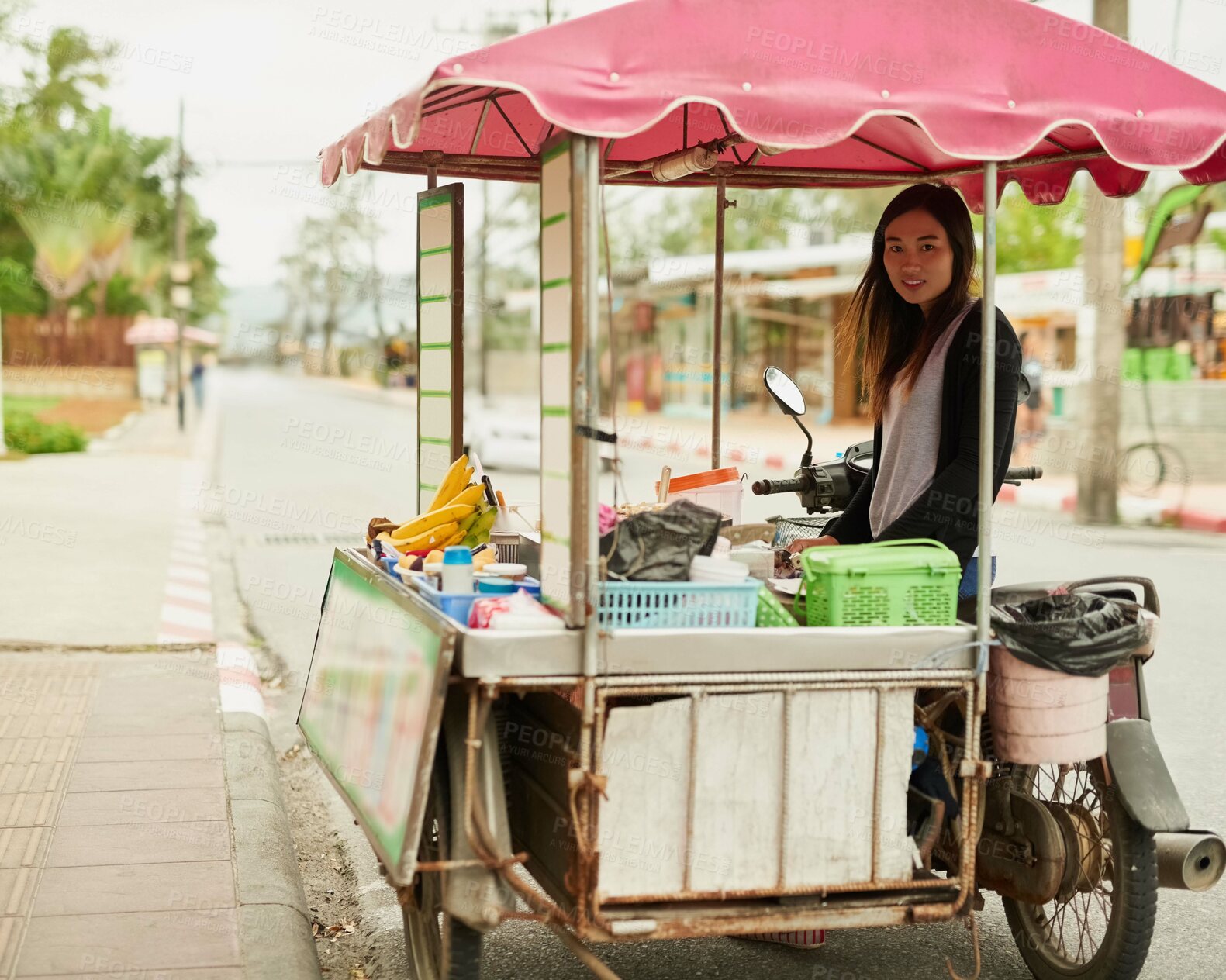Buy stock photo Asian woman, portrait and food vendor in street with fruit while driving motorcycle as startup in Thailand. Entrepreneur, face and work as small business owner with banana, cart and motorbike in road