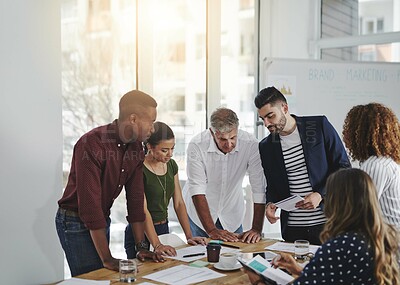 Buy stock photo People, creative and agency planning in workplace, paperwork and collaboration together for brainstorming. Discussion, work project and conversation for sales strategy, employees and business meeting