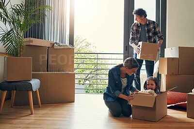 Buy stock photo Moving, boxes and parents with child in new house bonding together for family time at property. Relocation, mortgage and scared girl kid in cardboard with mom and dad unpacking packages for home.