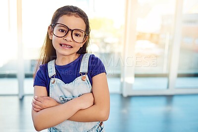 Buy stock photo Girl child, portrait and glasses for growth, arms crossed happy for development at home. Kid, smile or eyewear with youth fashion, modern clothes and casual style in house with confidence and frame