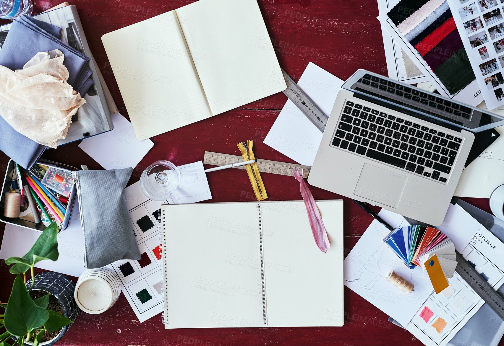 Buy stock photo High angle shot of a fashion designer's work desk