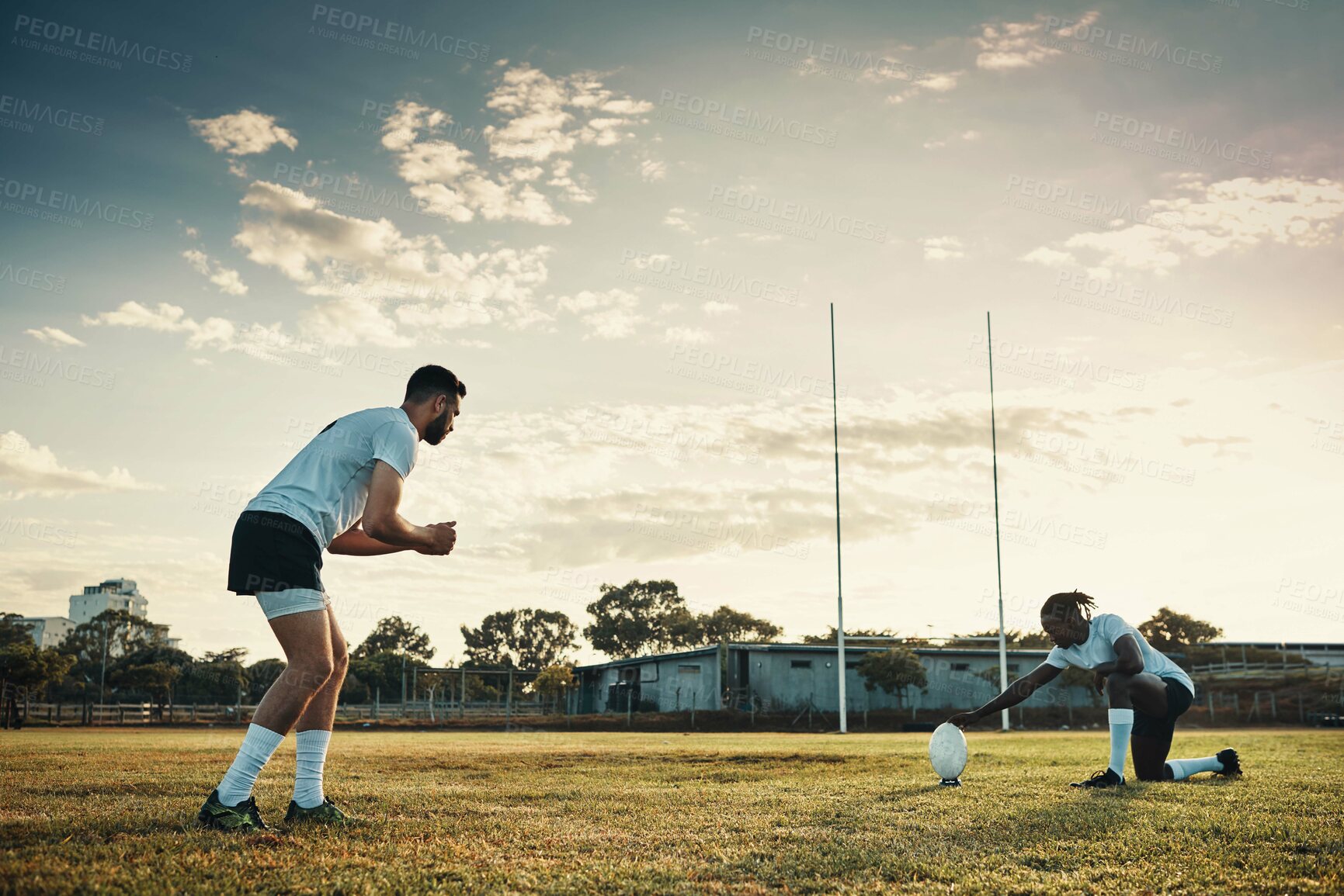 Buy stock photo Fitness, kicking and rugby with team of people outdoor on field together for competition or challenge. Ball, goal and training with sports player group on grass for exercise, game or match practice