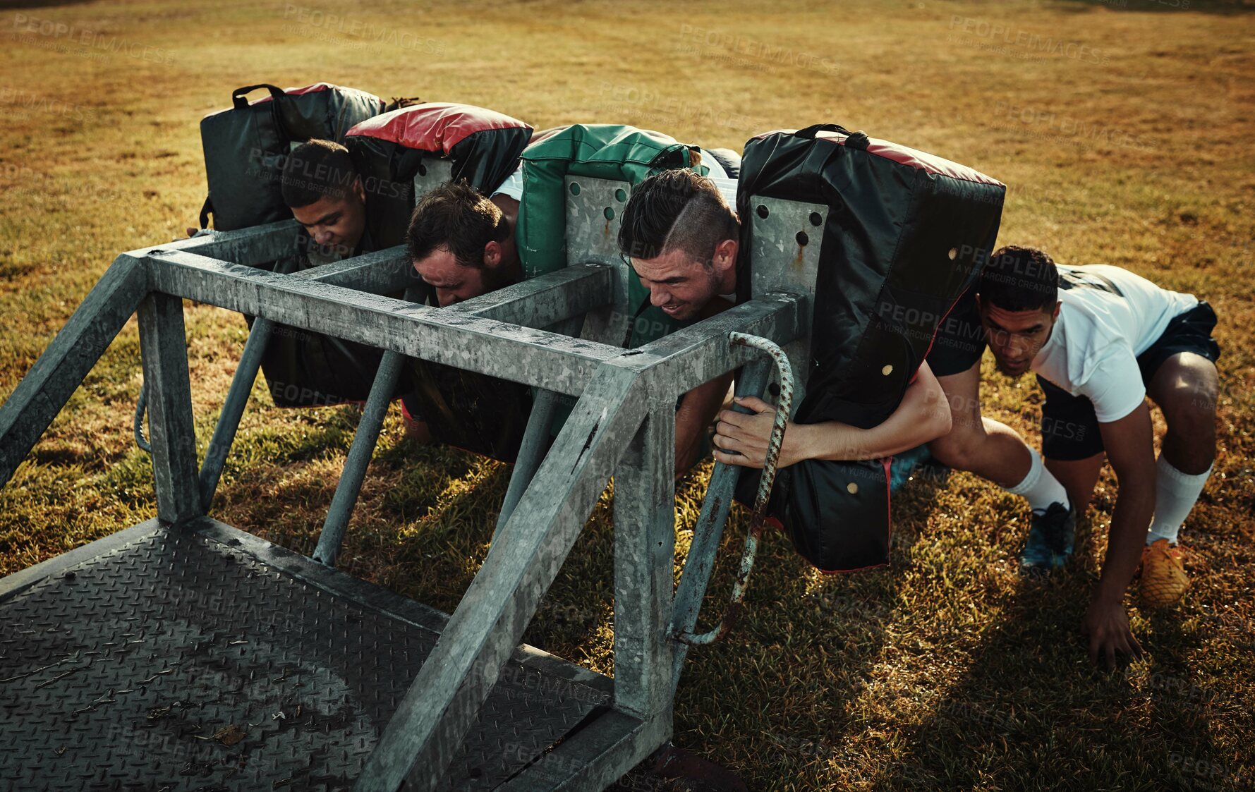 Buy stock photo Equipment, rugby and scrum training with team outdoor on field together for competition or challenge. Exercise, performance and sports with player group of people on grass for start of game or match