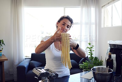 Buy stock photo Woman, handmade pasta and preparing in kitchen with dough for spaghetti, ingredients and gourmet meal in home. Cooking, food and female person with machine for diy, dinner or recipe in apartment