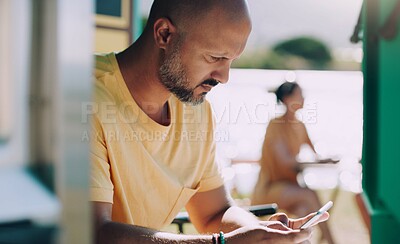 Buy stock photo Man, cellphone and typing in outdoor cafe for connection, talking and online reading for research. Male person, technology and communication in coffee shop by lake for social media or streaming 