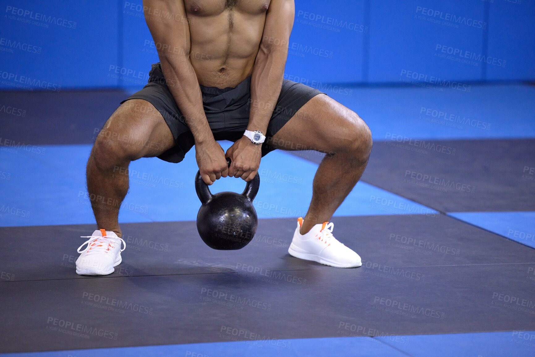 Buy stock photo Man, kettlebell and squat in workout at gym, weightlifting and training for power or strong legs. Male person, shirtless and fitness for muscle development, athlete and bodybuilder for exercise