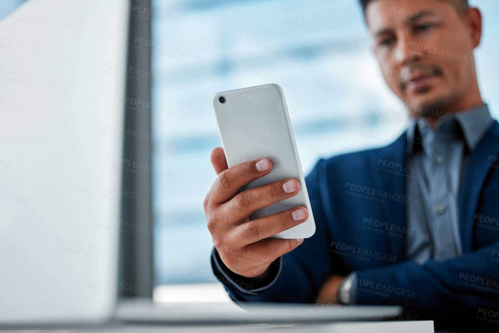 Buy stock photo Hand, phone and social media with business man in office for communication, networking or problem solving. App, contact and text message with corporate employee reading info at desk in workplace