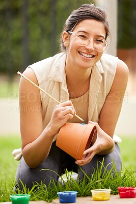 Buy stock photo Ceramic, pot and portrait of woman painting a craft container for plant in garden with creativity in hobby. Clay, art and artist with inspiration outdoor with paint brush, decoration or fun project