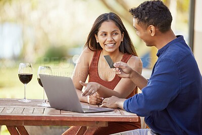 Buy stock photo Couple, credit card and outdoor by laptop for online shopping with wine glass, decision and sale on patio. Man, woman and computer for e commerce, talk or fintech with smile at countryside restaurant