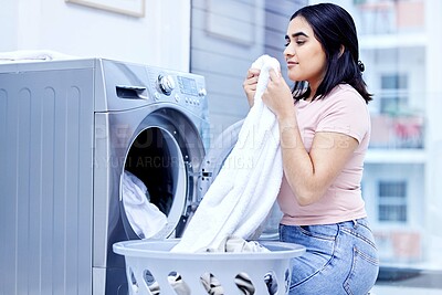 Buy stock photo Laundry machine, smell and woman in home for cleaning, hygiene and housework in the morning. Chores, scent and girl with fresh fabric, cotton clothes and textile towel in washing basket for service